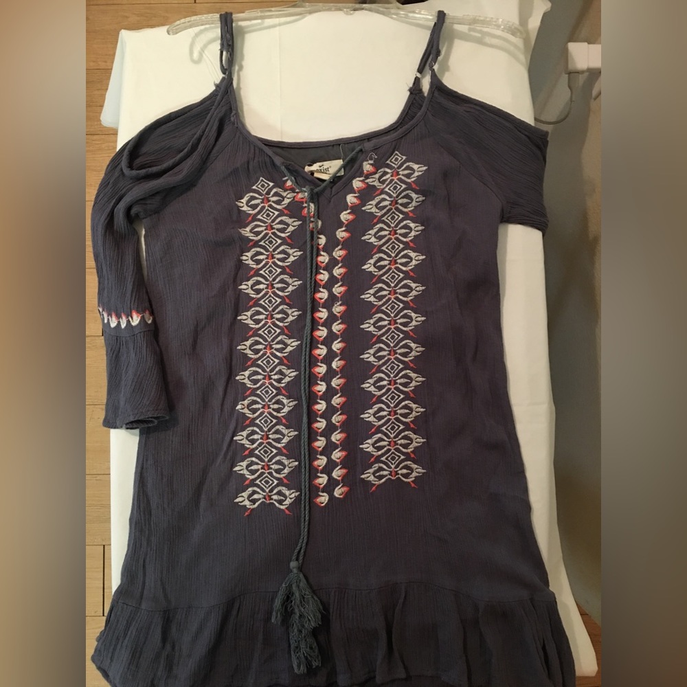 Open shoulder tunic with tassels